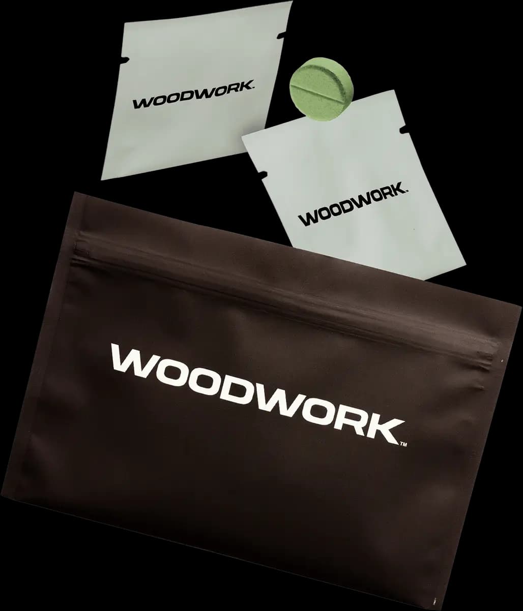 Woodwork-branded packaging and green tablet floating together